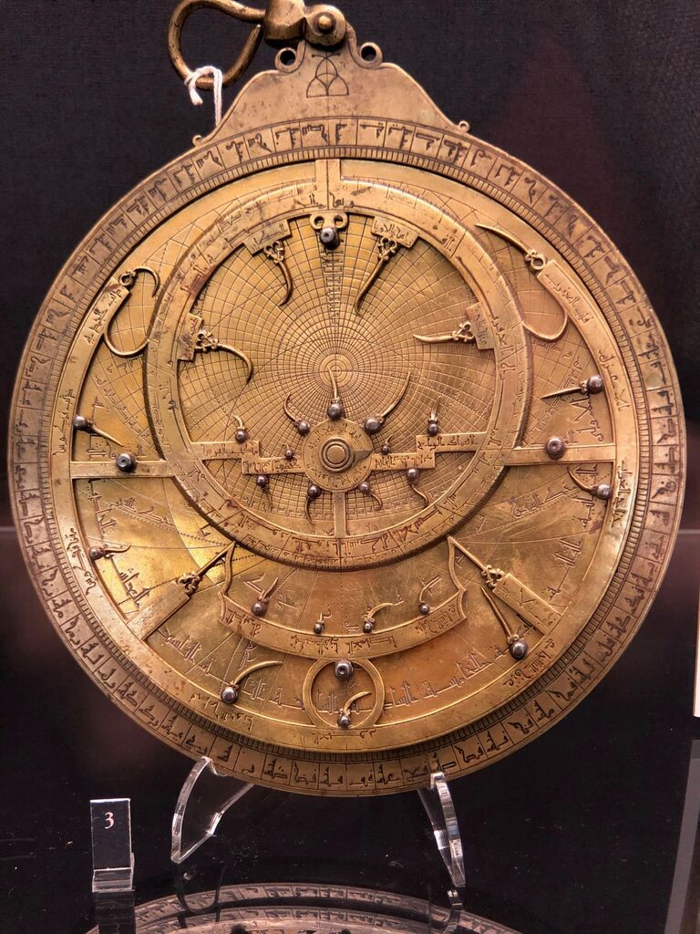 Brass astrolabe on a stand, with abjad numerals (Arabic letters used as numerals)