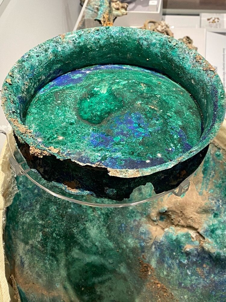 Copper lid almost entirely turned a deep green with deep blue areas